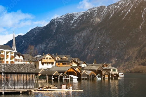 Traditional wooden boat houses in Hallstatt - mountain village at Hallstaetter Lake, Salzkammergut. UNESCO world heritage site, old European architecture.