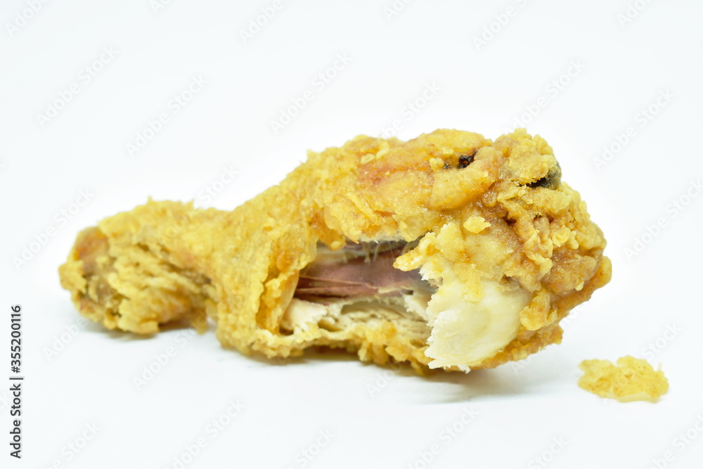 crispy fried chicken drum wing biting on white background crispy fried chicken drum wing biting on white background