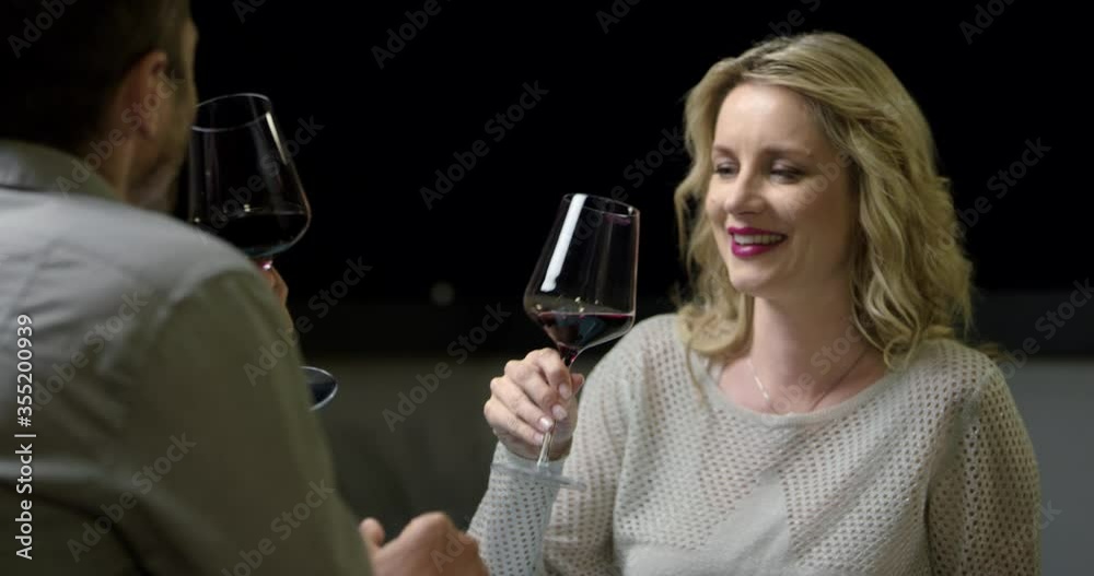 4K Of Married Couple Toasting While A Glass Of Red Wine While Chatting 4K Of Married Couple Toasting While A Glass Of Red Wine While Chatting
