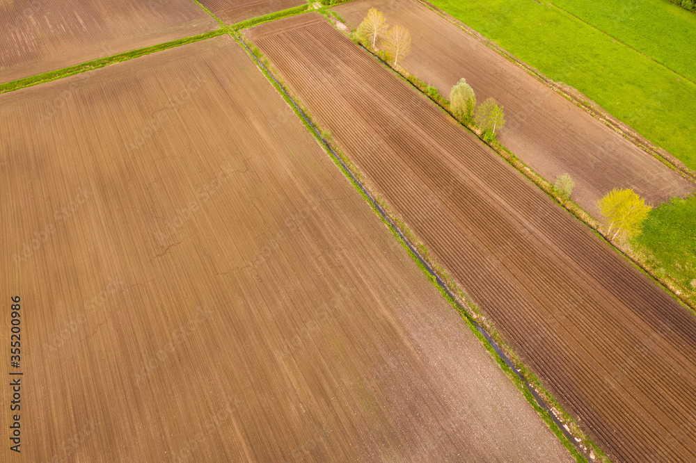 Aerial view of the countryside fields . Cultivation background