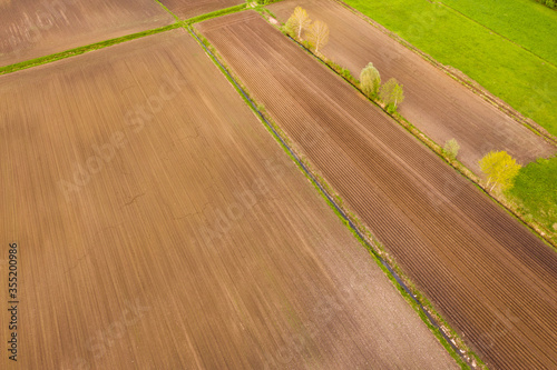 Aerial view of the countryside fields . Cultivation background