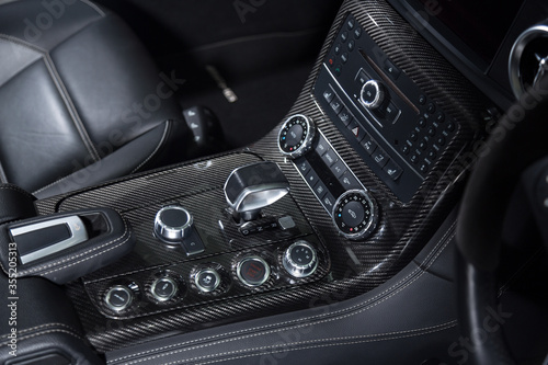 Carbon fiber control buttons in luxurious car interior