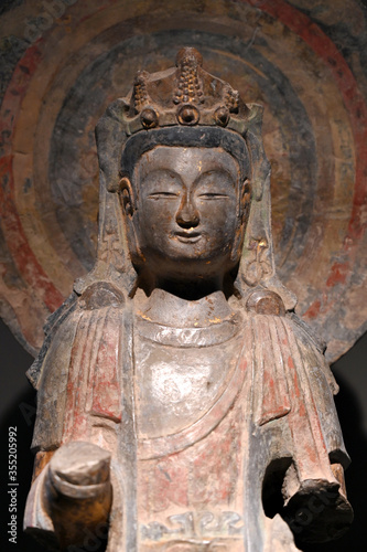 Close-up of the head of a bodhisattva carved in stone in an ancient Chinese Buddhist temple