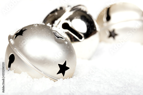 Silver jingle bells in the snow photo