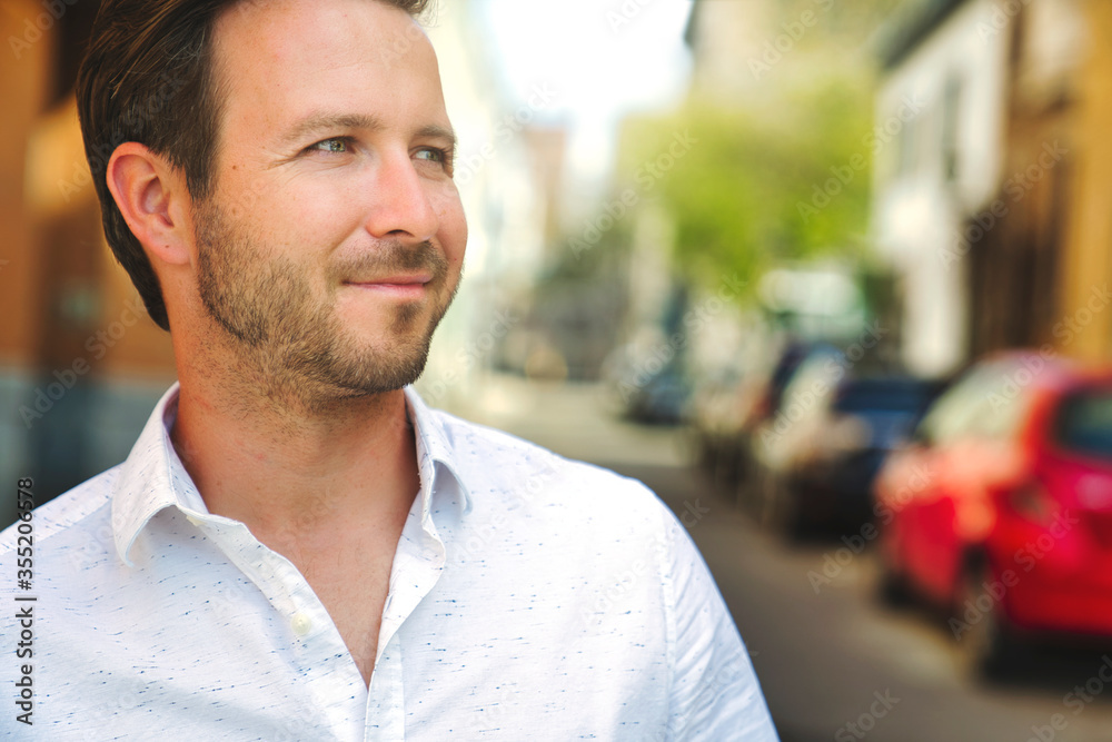 Portrait of an handsome man on the urban background