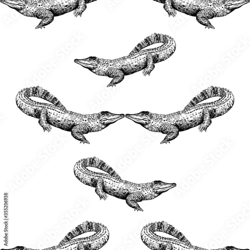 Seamless pattern of hand drawn sketch style crocodiles isolated on white background. Vector illustration.