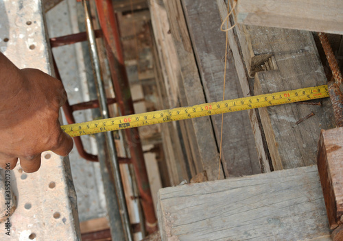 JASIN, MALAYSIA -MARCH 10, 2016: Measuring tape used at the construction site.  photo