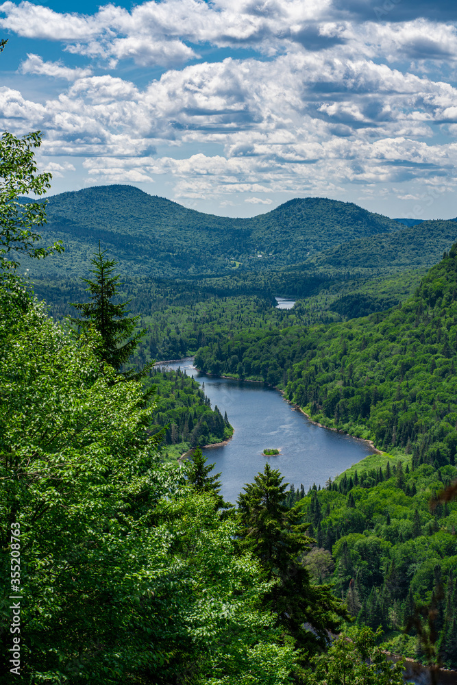 Awesome summer view from a verdant hill in Jacques Cartier National Park, Quebec province, Canada