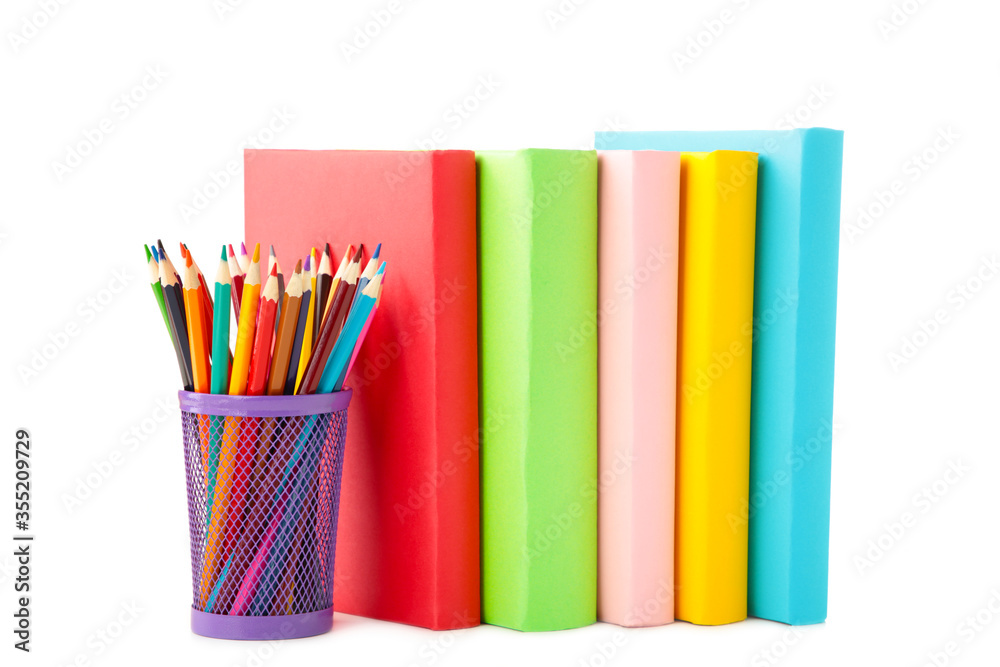 Fototapeta premium Multi coloured school books and pencils isolated on white background