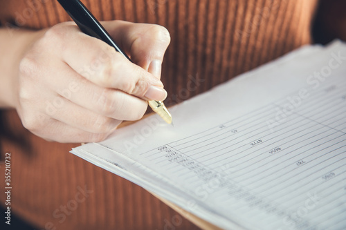 woman hand document and signature