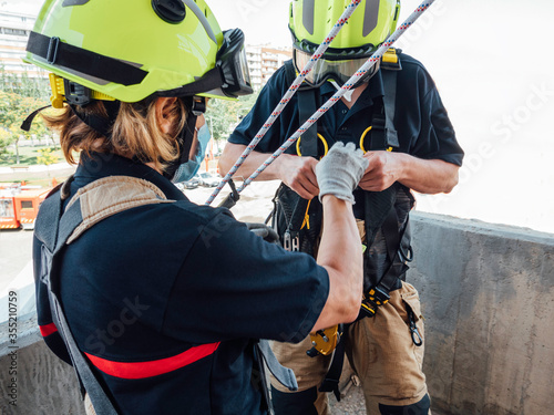 Firefighters in vertical rescue practices during a training exercise Rescue concept