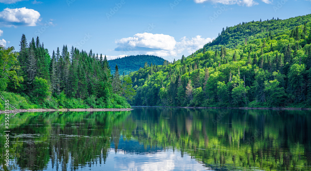 Awesome summer view from a verdant hill in Jacques Cartier National Park, Quebec province, Canada