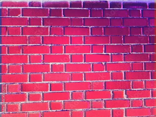 Abstract background image of a bright pink brick wall