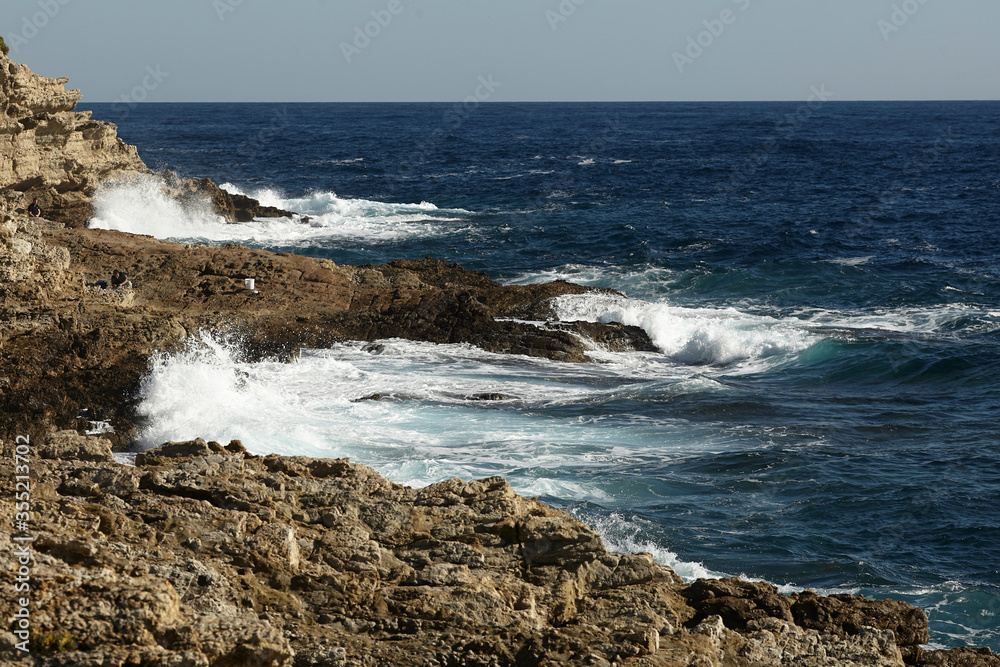 Dramatic view on mediterranean sea. Waves on a sea cliff.