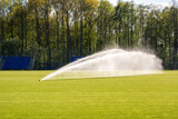 Automatically watering a green lawn on a soccer field