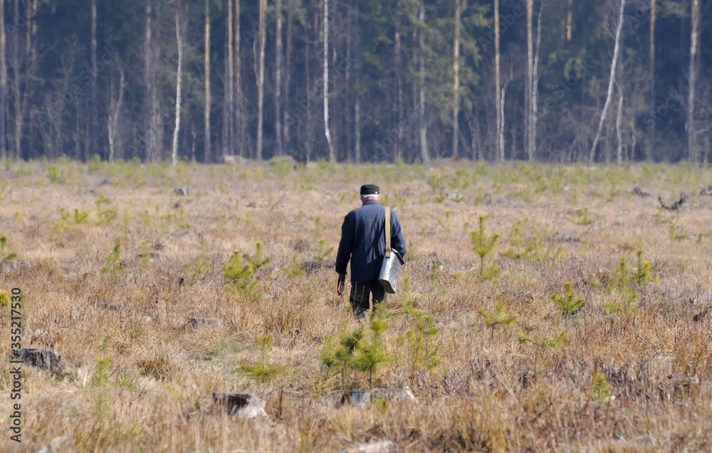 An elderly man goes fishing. Moscow region. Russia. An elderly man goes fishing. Moscow region. Russia.
