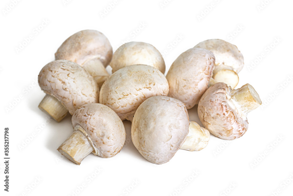 Bunch of white mushrooms isolated on a white background Bunch of white mushrooms isolated on a white background