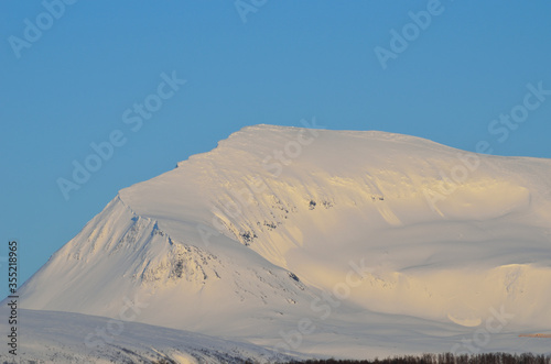 snowy mountain on blue sky