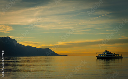 Boat on lake Geneva beautiful sunset colors