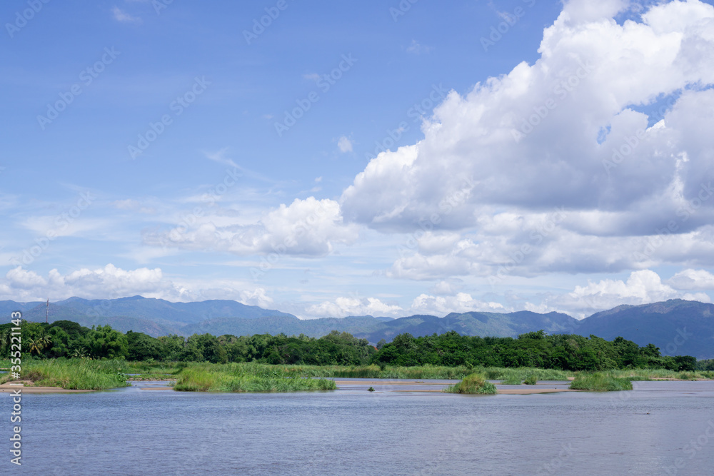 Rivers and forests, mountains and blue skies