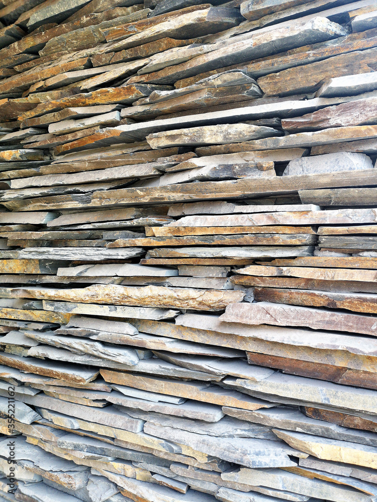 Rough stone stacked building wall