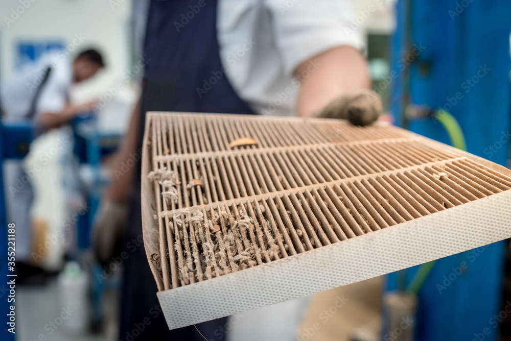Foto de Car air conditioner filter in the cabin of the car is dirty and