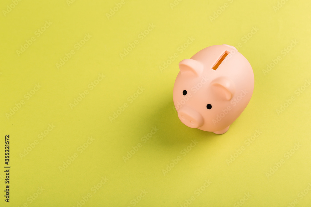 pink piggy bank on a green background. pink piggy bank on a green background.
