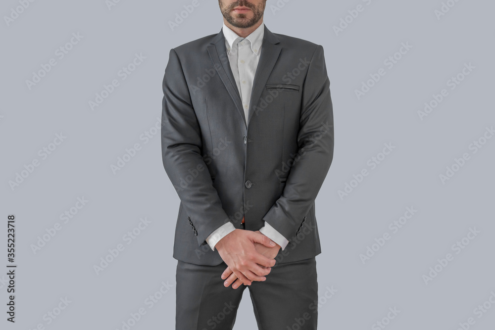 Man in elegant custom tailored expensive suit posing staight Man in elegant custom tailored expensive suit posing staight