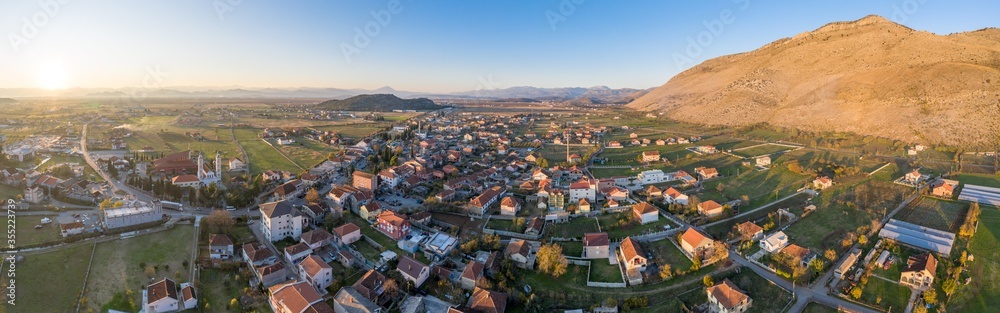 Tuzi, the youngest municipality in Montenegro, in the afternoon, close to sunset. Center of Malesi e Madhe District, populated mainly by Malisors. Situated at the foot of Decic hill. Aerial shot.