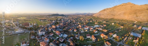 Tuzi, the youngest municipality in Montenegro, in the afternoon, close to sunset. Center of Malesi e Madhe District, populated mainly by Malisors. Situated at the foot of Decic hill. Aerial shot.