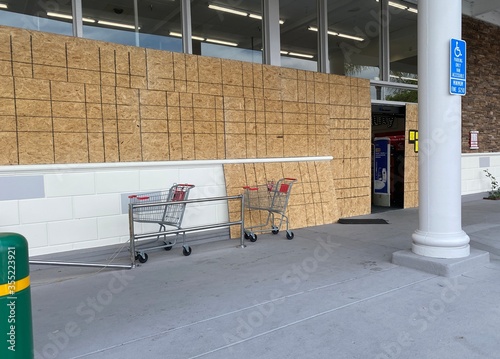 Φωτογραφία boarded up to protect a business from damage due to disasters such as storms, ri