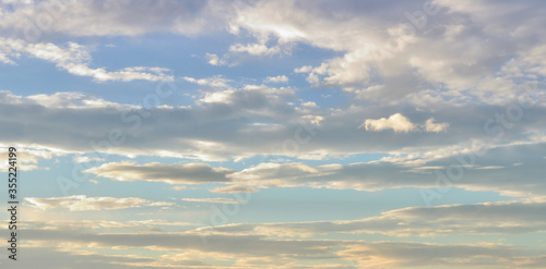 Evening sky with clouds. Golden hours sky. Pink afternoon vanilla sky