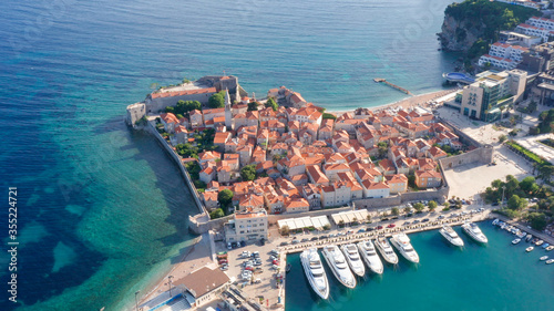 Obraz na płótnie Budva Montenegro - famous summer vacation tourist destination on the coast of turquoise Adriatic sea. Medieval old town and marina for small boats and yachts in the Mediterranean, in south Europe. w salonie