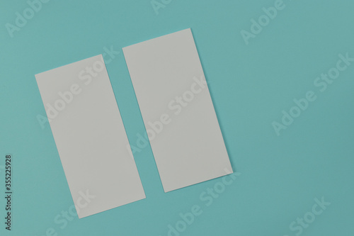 Bifold white template paper on blue texture. copy space.