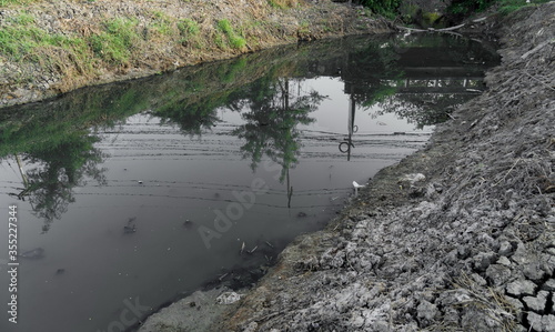 Waste water, sewage in the canal © Hiko