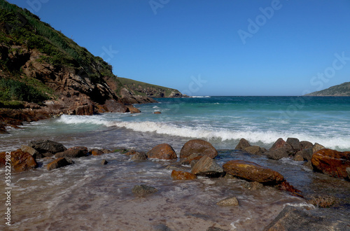 Wallpaper Mural A Brazilian beach with a turquoise blue sea, a mountain and a clear blue sky without clouds. Torontodigital.ca