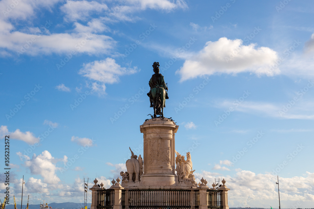 Fototapeta premium Lisbon Portugal: historical equestrian statue of King Jose I, finished 1775, seen from the back, on the central square.