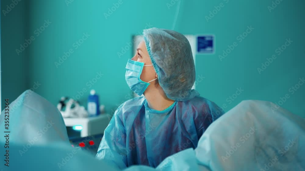 Process of gynecological operation. Young woman lying in gynecological