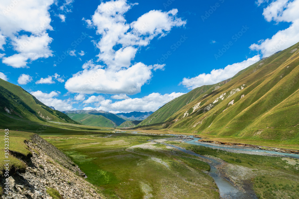  Truso Valley and Gorge trekking / hiking route landscape, in Kazbegi, Georgia. Truso valley is a scenic trekking route close to the border of North Ossetia.
