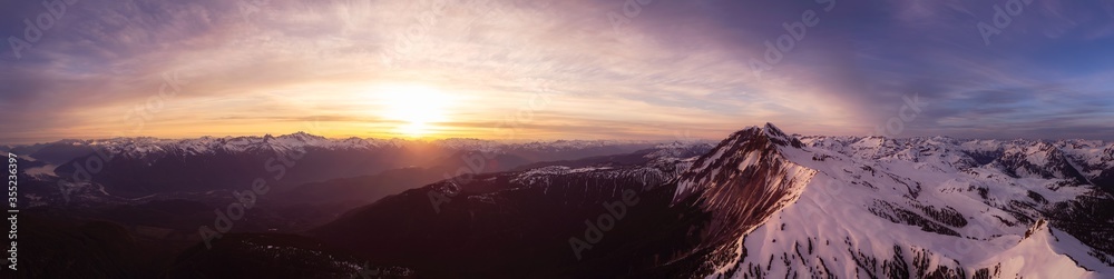 Aerial Panoramic View of Canadian Mountain Landscape during a colorful sunset. Taken in Garibaldi, near Whistler and Squamish, North of Vancouver, British Columbia, Canada. Nature Background Panorama