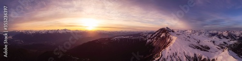 Aerial Panoramic View of Canadian Mountain Landscape during a colorful sunset. Taken in Garibaldi, near Whistler and Squamish, North of Vancouver, British Columbia, Canada. Nature Background Panorama © edb3_16