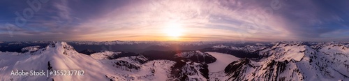 Aerial Panoramic View of Canadian Mountain Landscape during a colorful sunset. Taken in Garibaldi, near Whistler and Squamish, North of Vancouver, British Columbia, Canada. Nature Background Panorama
