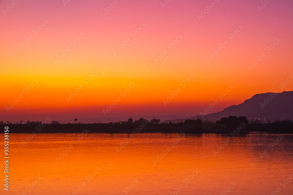 Fototapeta premium Nile river at sunset in Luxor, Egypt.
