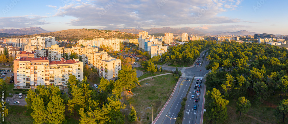 Φωτογραφία Podgorica Montenegro: City blocks 5 and 6, main boulevard and Tolosi wood (Toloska suma) late in the afternoon, close to sunset