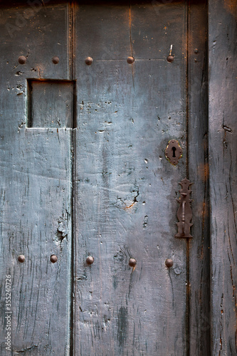 Wallpaper Mural Spanish old rustic wooden door painted in gray Torontodigital.ca