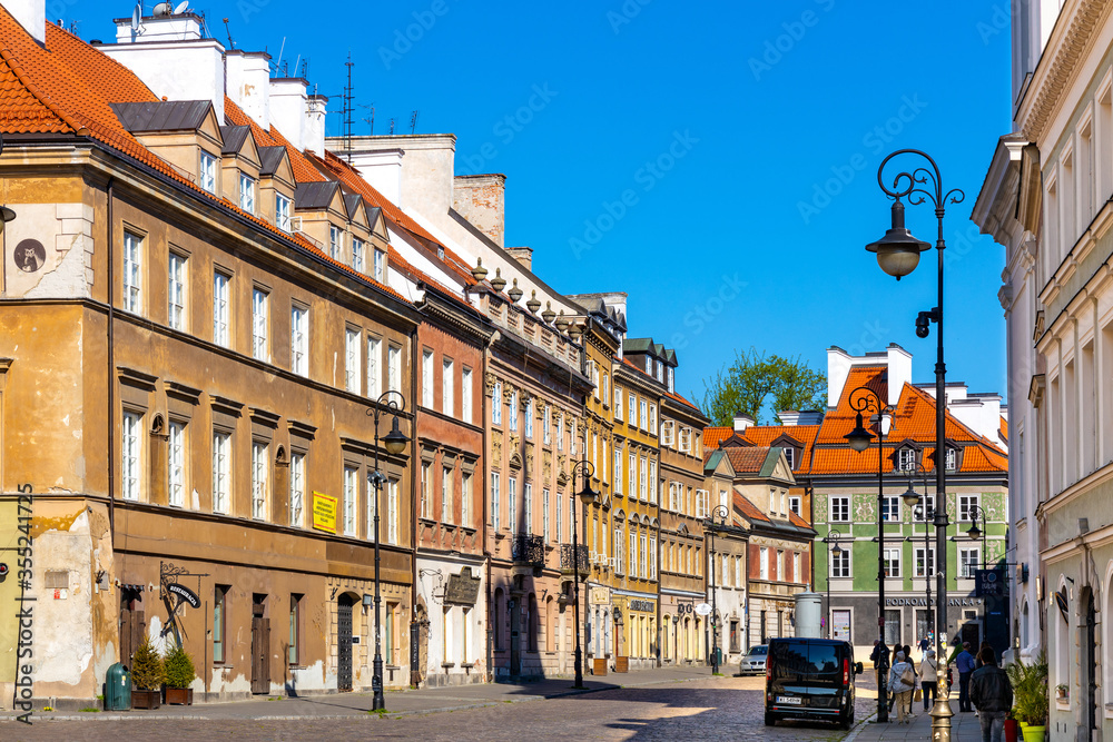 Colorful renovated tenement houses of historic New Town quarter - Nowe Miasto - along Freta street in Warsaw, Poland