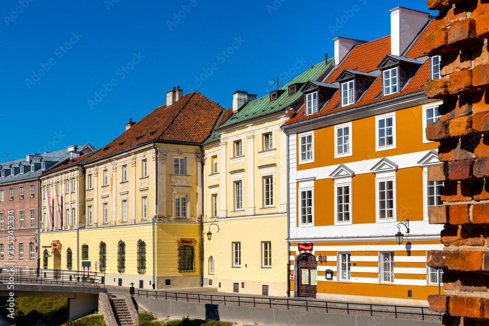 Colorful renovated tenement houses of historic New Town quarter - Nowe Miasto - along Podwale street in Warsaw, Poland