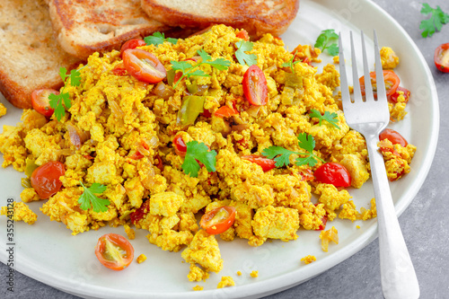 Tofu Scramble with Toasted bread, Vegan Food, Vegan Breakfast, Dark Background, Healthy Food Photography
