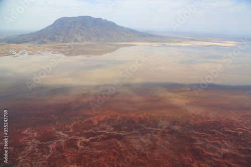 Aerial view of Lake Natron in the Great Rift Valley, on the border between Kenya and Tanzania. The Rift Valley contains a chain of volcanoes, some of which are still active, and many alkaline lakes.