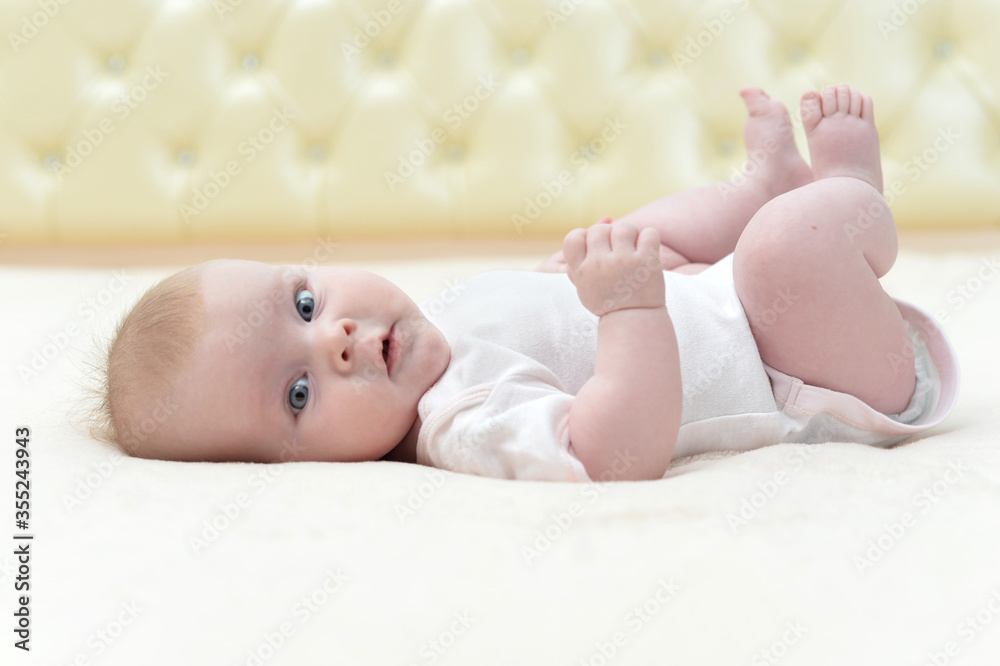 Cute little baby girl looking at the camera Cute little baby girl looking at the camera